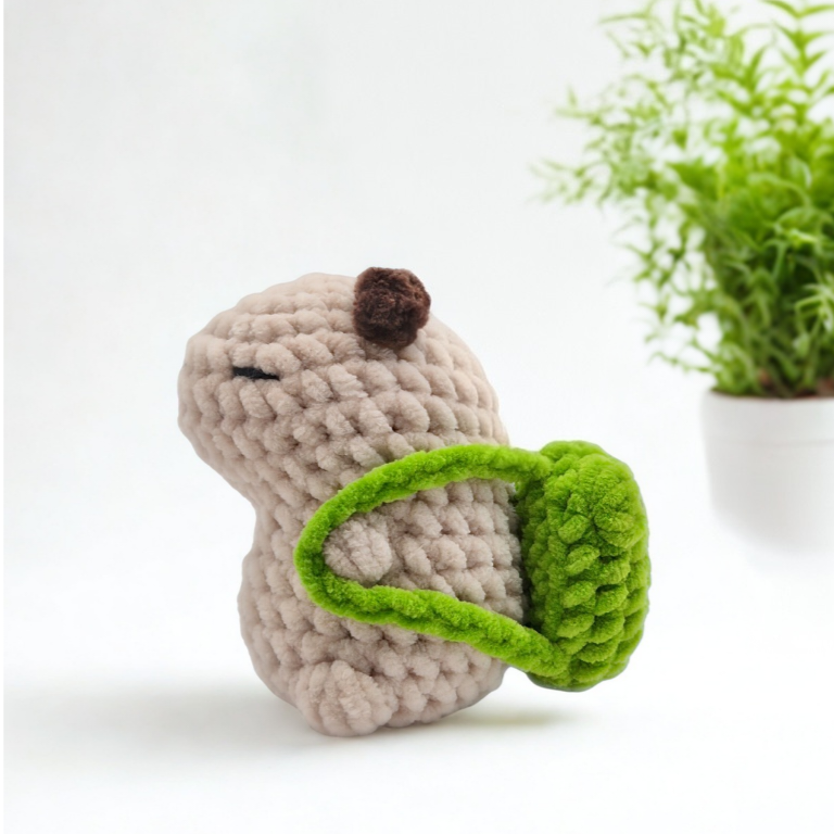 Handmade capybara amigurumi with frog backpack accessory, UK terms US terms crochet pattern PDF.