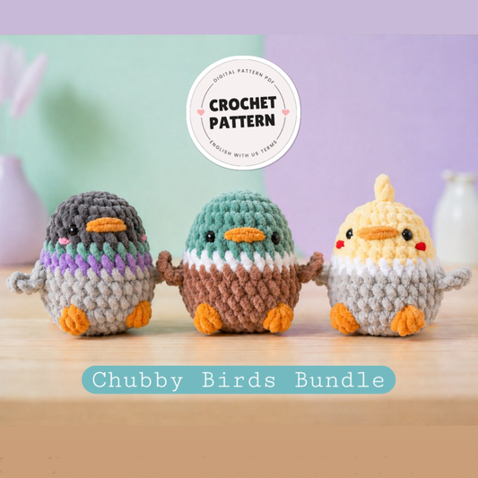 Three crocheted birds in different colors on a wooden surface with a 'Crochet Pattern' label above them.